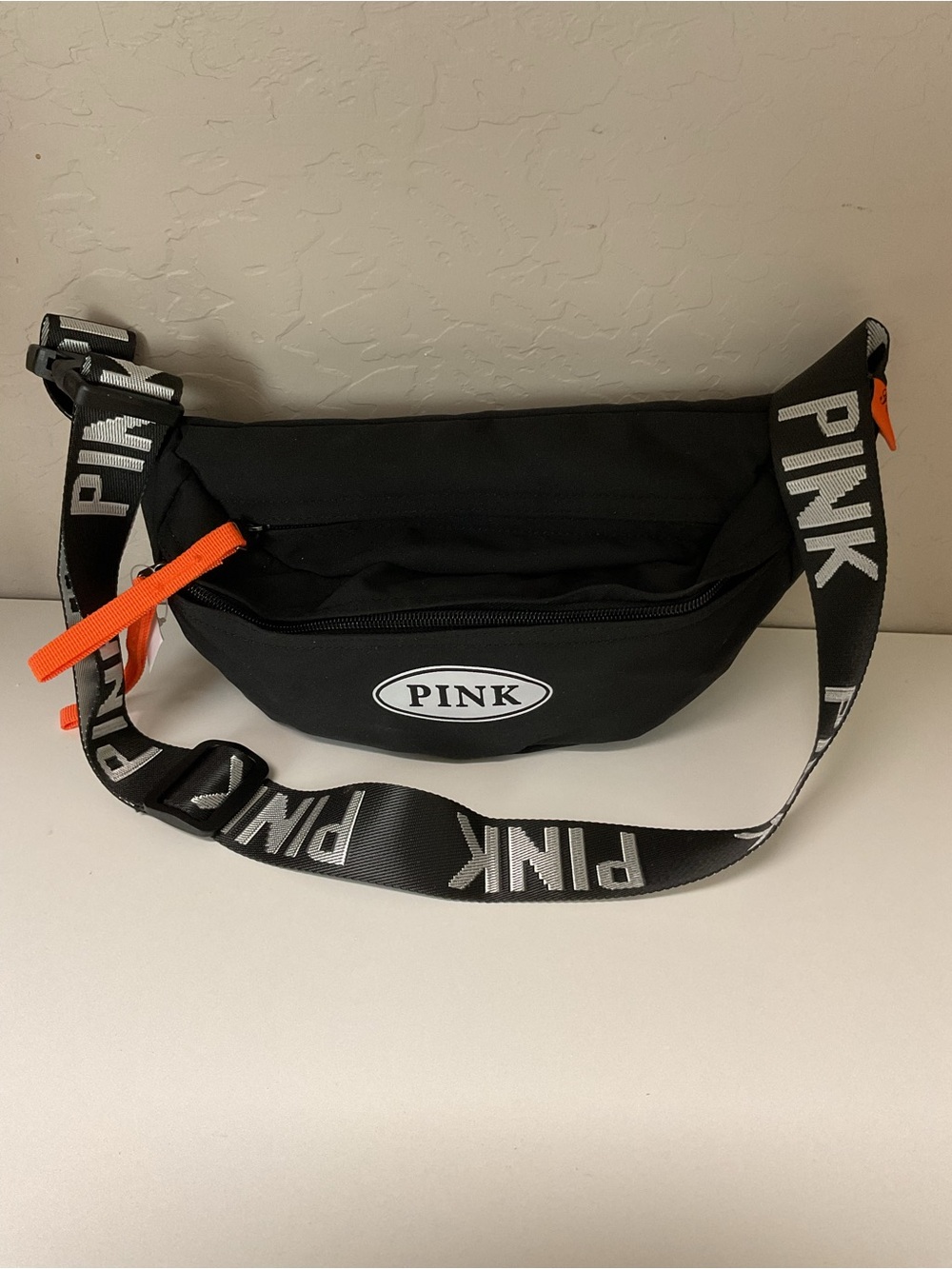 PINK Victoria's Secret Black Belt Bag with White Logo and Orange Zipper Accents